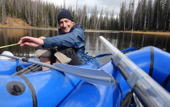 Scientist John Calder in a boat