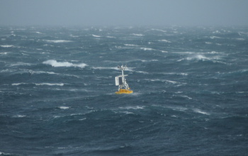 A surface buoy bobs in waves at the OOI Global Argentine Basin site in the Southern Hemisphere.