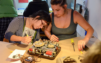Two women working at the Exploratorium Tinkering Studio