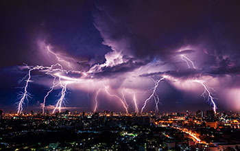 Numerous lightning strikes during a thunderstorm.