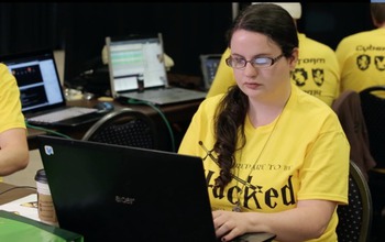 Female student at computer keyboard.