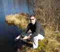 Scientist Ryan Batt obtains readings of oxygen levels in a lake in northern Wisconsin.