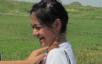 Student with a haorned toad on her shoulder