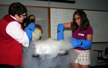 "SciGirls" camp participant Alex Wells checks out her newly finished batch of nitrogen ice