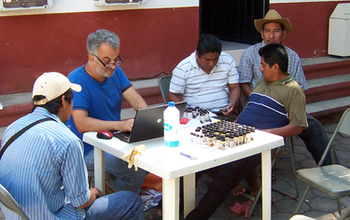 Men sitting at a table.