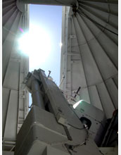 Sunlight floods through the dome aperture of the Evans Solar Facility at National Solar Observatory