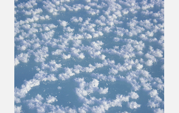 Surface hoar crystals can be seen on the ice of the La Chute River in the Yukan Territory