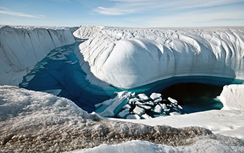 A Greenland ice canyon filled with melt water in summer 2010