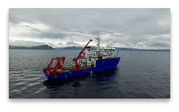 R/V <em>Sikuliaq</em> assisting in the recovery of one of 54 seafloor electromagnetic receivers