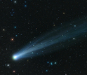 photo of comet Ison in the sky through a telescope