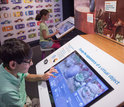 Kids use Pixar's Ratatouille interactive display at the Museum of Science.