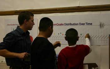 student looking at a graphic in a classroom