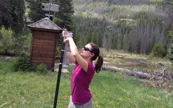 Researcher collecting precipitation samples