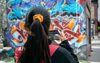 Girl takes photo with cell phone