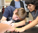 Students work on digital fabricated speaker system.