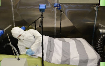 researcher in a lab testing a mattress for chemicals