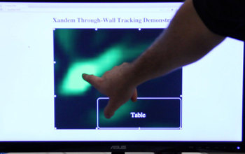 man touching the screen for a xandem demonstration