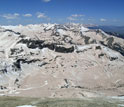 Photo showing desert dust tinging show red in Colorado mountains.