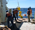 Photo of mooring operations on deck of the research vessel Knorr.