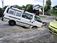 Sink holes and liquefaction on roads in Christchurch, New Zealand.