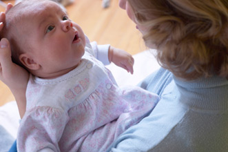 Photo of a mother holding a baby.