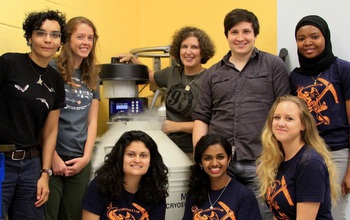 Biologist Liliana Dávalos conducting research in the lab with graduate and undergraduate students.