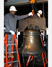 Riggers carefully position tackle that will be used to hoist the Liberty Bell.