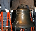 Riggers carefully position tackle that will be used to hoist the Liberty Bell.