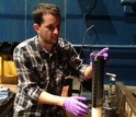 Blair Paul samples a sediment core from the seafloor area where self-mutating organisms were found.