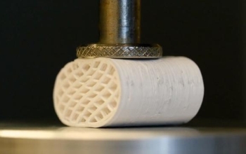 artificial bone being pressed in a vice