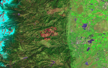 Map showing Boulder Creek, and tributary Fourmile Creek, with red burn scar from a wildfire.