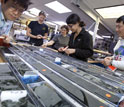 Photo of geologists sampling a sediment core.