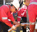 Scientists remove the core catcher from a core barrel.