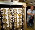 Air-sampling flasks used during HIPPO flights and researcher Andy Watt on the plane