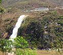 Small hydropower plant discharges water from tributary to main channel of the Nu River.