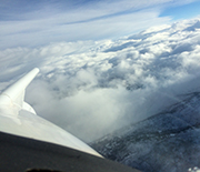 clouds with the wing of a plane