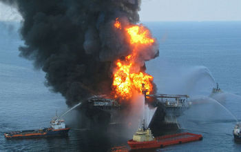 A photo of the Deepwater Horizon oil drilling rig on fire at the time of the spill.