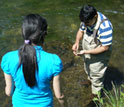 Photo of scientist P.V. Sundareshwar on right and colleague examining Didymo.