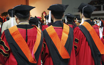 Photo of students with PhD caps and gowns