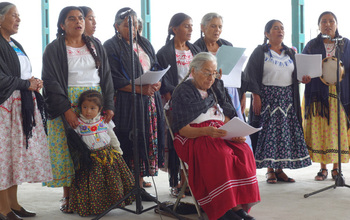 choir of women singing.