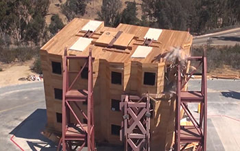 Damaged woodframe building on a shake table