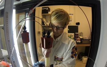 researcher operating medical lab equipment