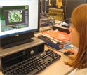 a girl using a computer