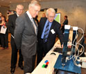 Photo of Sen. Reid with shake table that simulates earthquake motions.