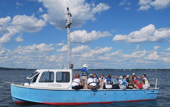 people on a boat on a lake