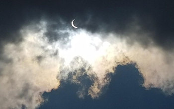 Clouds threatened to block view of solar eclipse