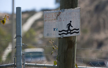 Placards posted in the Tijuana River Valley