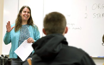 teacher in front of students in a class