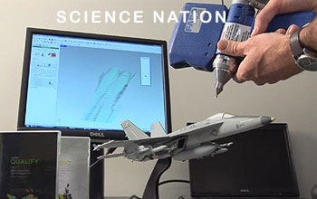 Scanning a model plane with hand-held device and monitor showing scan under the words Science Nation