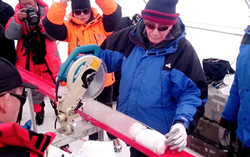 scientist Lonnie Thompson cuts an ice core